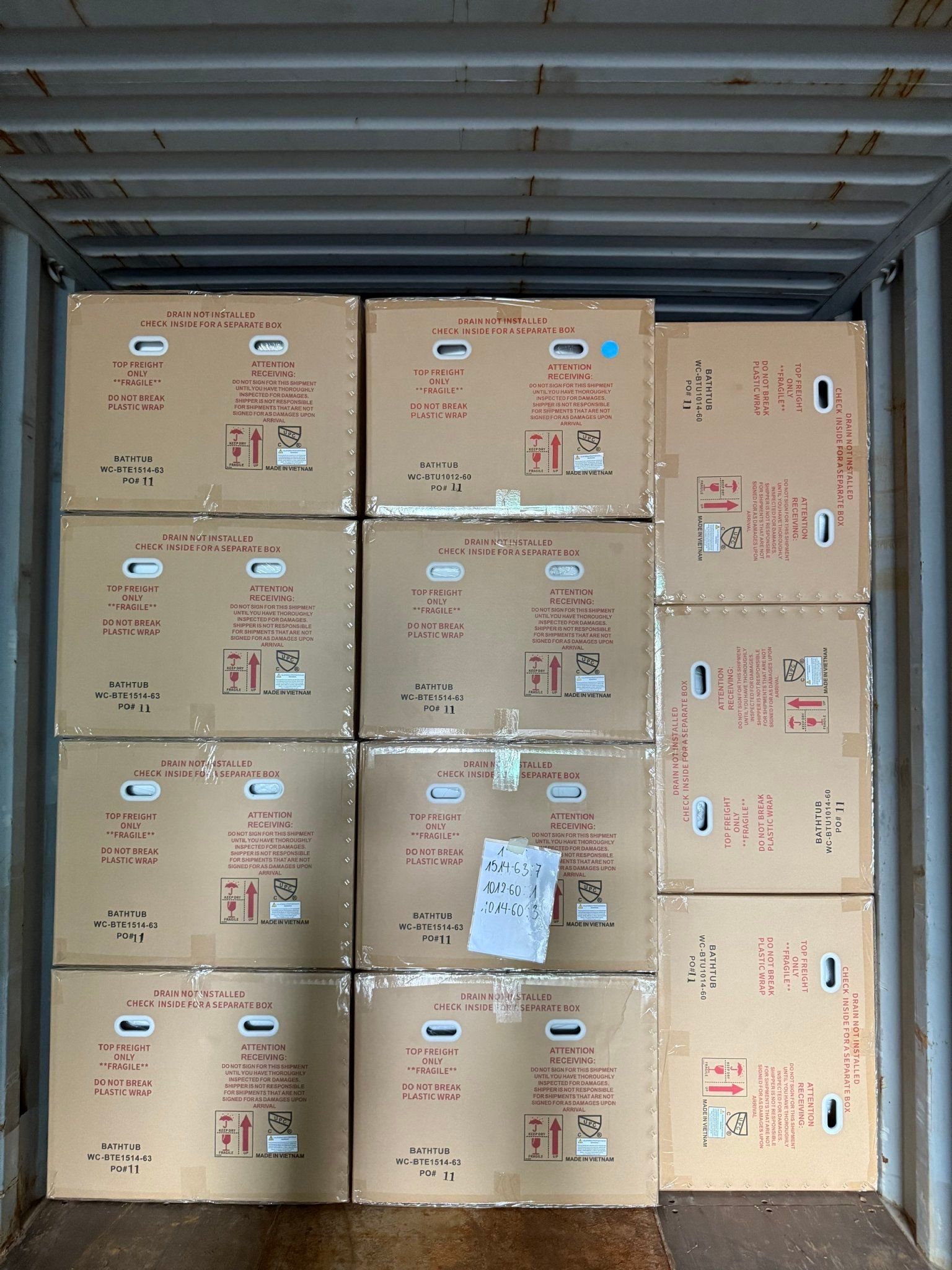 Bathtub export cartons arranged inside a shipping container