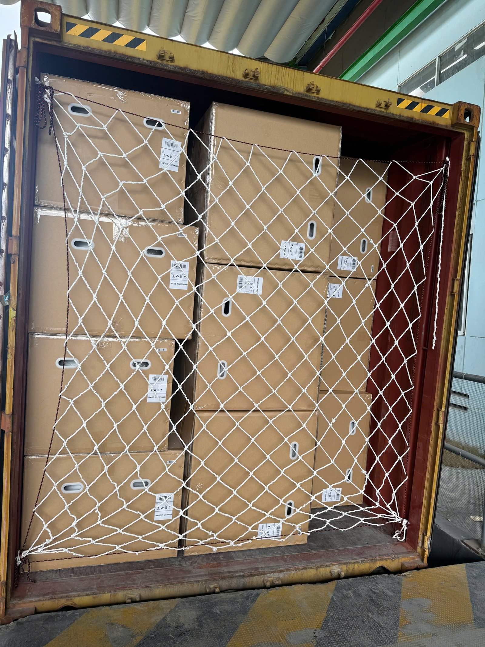 Acrylic bathtub export packaging secured inside a shipping container